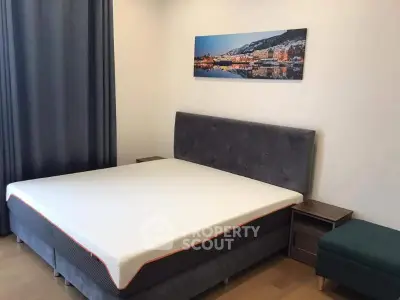Modern bedroom with stylish decor and comfortable bed in a cozy apartment.