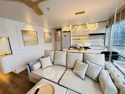 Luxurious modern living room with elegant decor and open kitchen layout, featuring cityscape views.