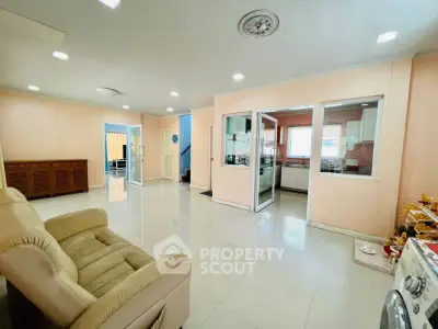 Spacious living room with modern design and open kitchen layout