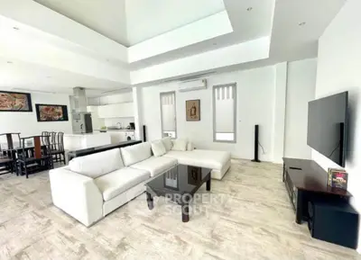 Spacious modern living room with open kitchen and elegant decor