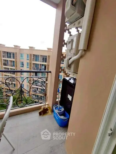 Charming balcony with elegant railing and view of neighboring building, perfect for relaxation.