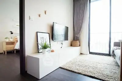 Modern living room with large window and stylish decor