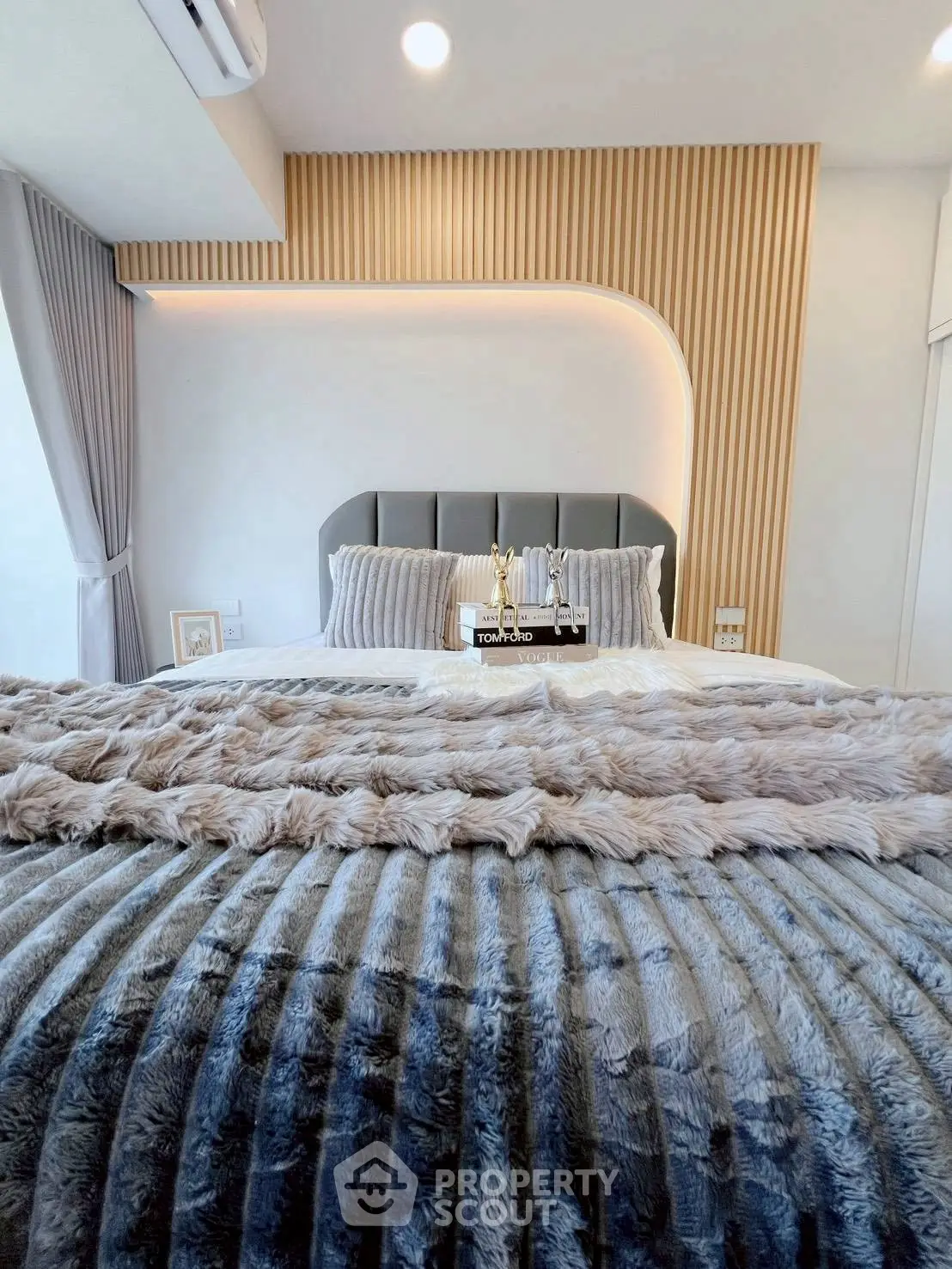 Luxurious modern bedroom with plush bedding and stylish decor