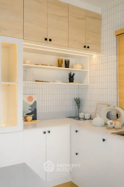 Modern kitchen with sleek white cabinets and stylish decor