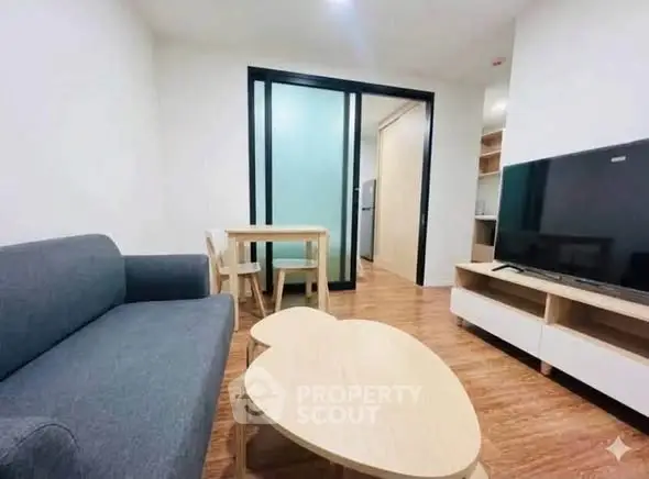 Modern living room with sleek furniture and open layout, perfect for cozy gatherings.