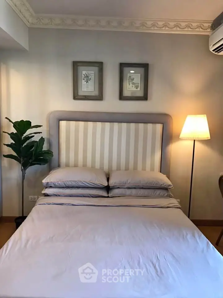 Cozy bedroom with elegant decor and soft lighting