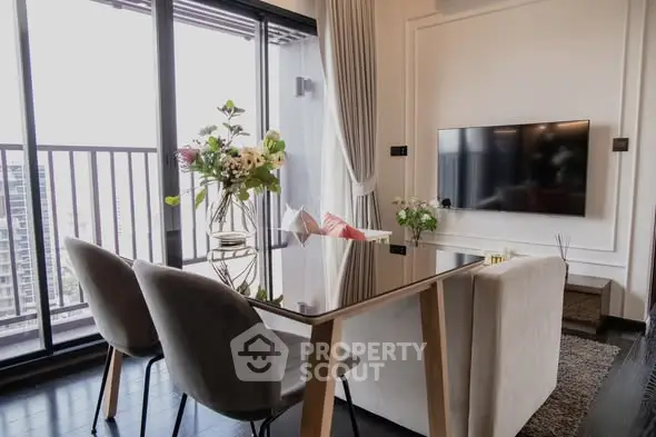 Elegant living room with modern decor and balcony view in luxury apartment.