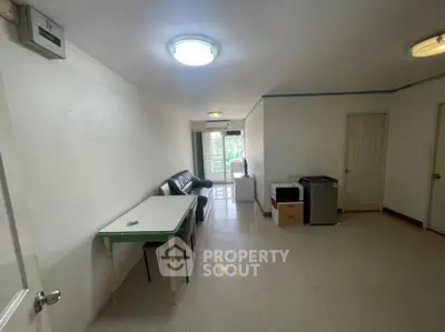 Spacious living room with natural light and minimalistic decor