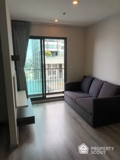 Modern living room with balcony view in urban apartment