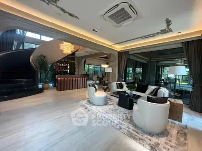 Luxurious living room with elegant decor and spiral staircase, perfect for entertaining.