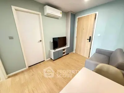 Modern living room with sleek design, featuring air conditioning and stylish furniture.