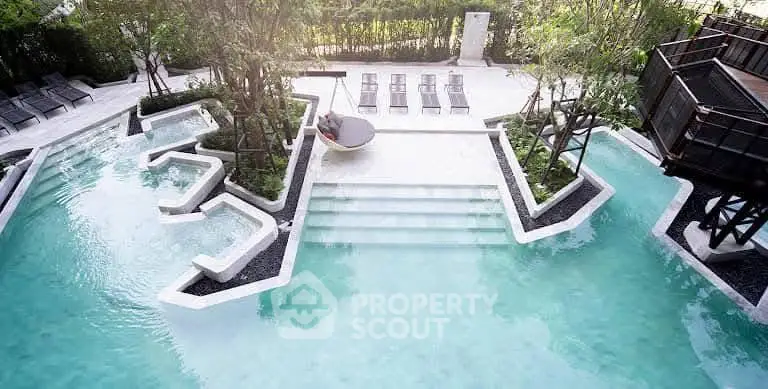 Luxurious outdoor pool area with modern design and lush greenery, perfect for relaxation and leisure.