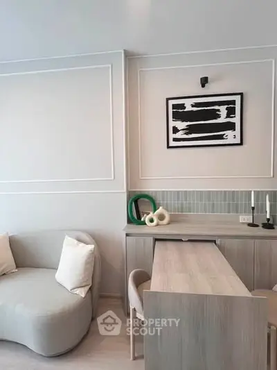 Modern living room with stylish furniture and contemporary wall art