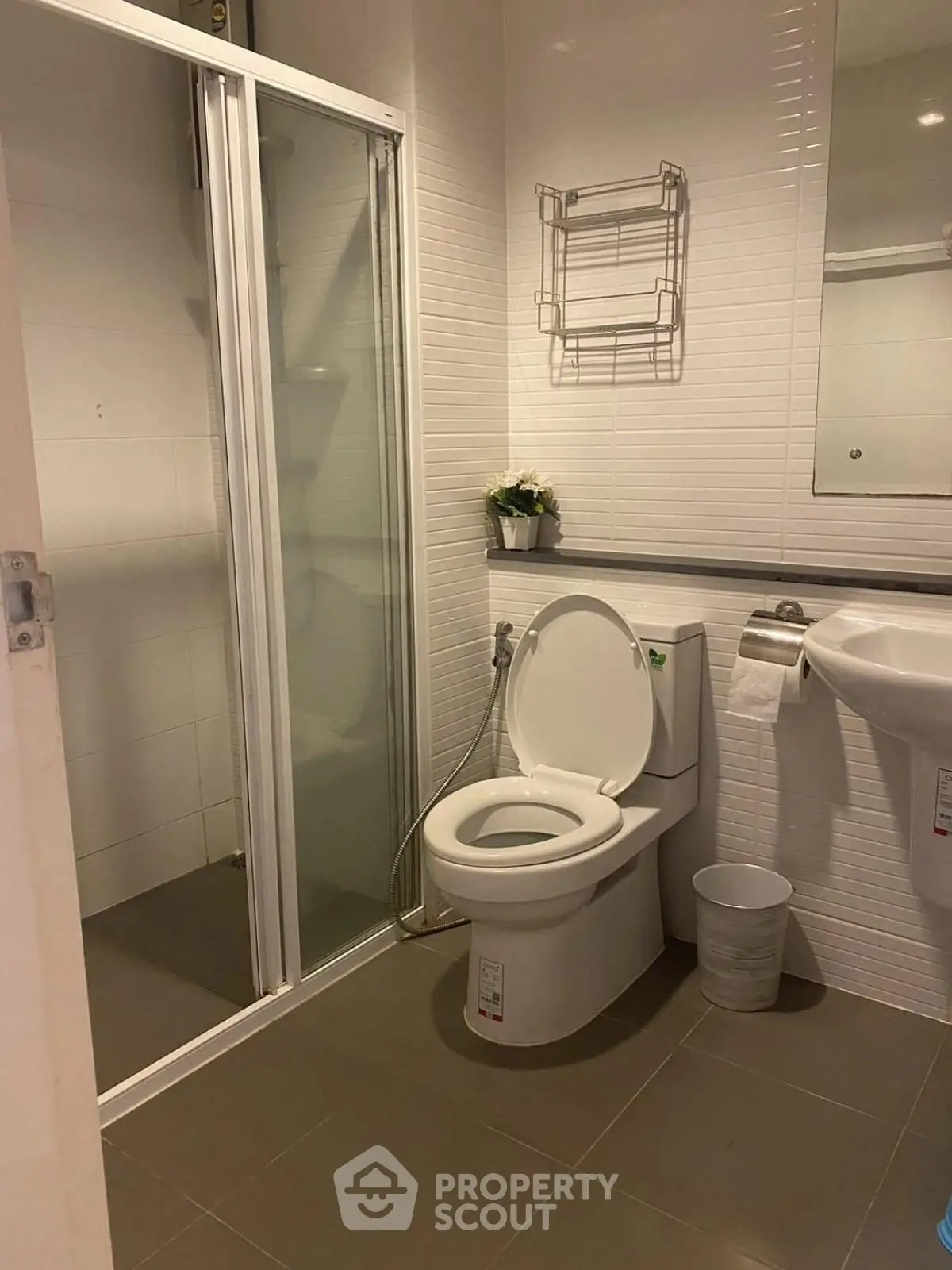 Modern bathroom with shower and toilet in a sleek design