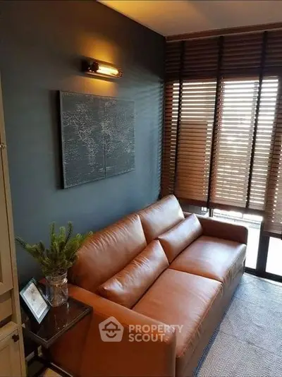 Stylish living room with leather sofa and modern decor