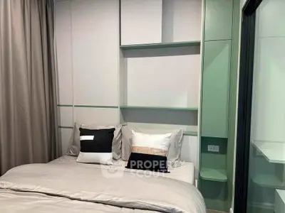 Modern bedroom with stylish decor and built-in shelving, perfect for urban living.