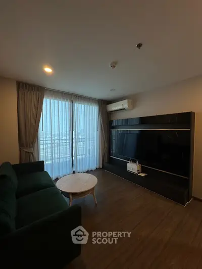 Modern living room with large TV and stylish furniture