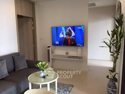 Modern living room with wall-mounted TV and stylish decor