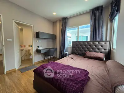 Modern bedroom with ensuite bathroom and stylish decor