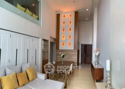 Modern living room with high ceiling and elegant decor