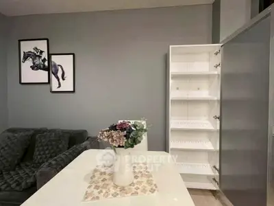 Modern living room with stylish decor and open shelving unit