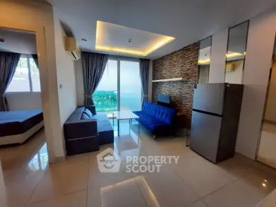 Modern living room with stylish decor and natural light in a contemporary apartment.