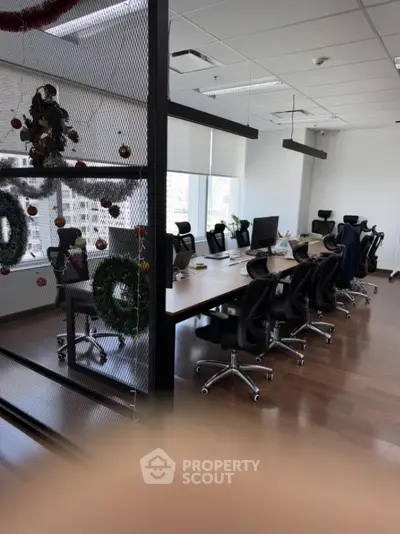 Modern office space with ergonomic chairs and festive decorations
