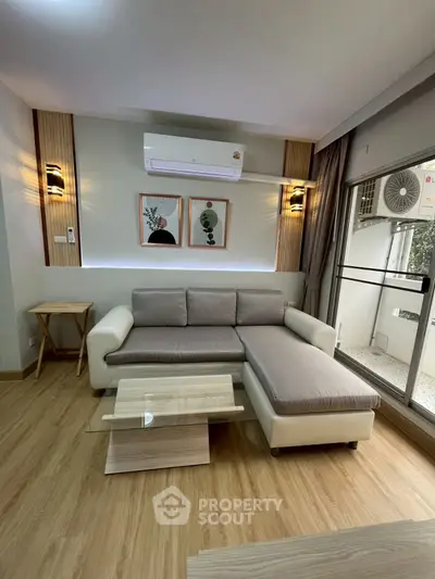 Modern living room with stylish sofa and air conditioning unit