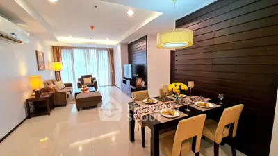 Spacious modern living and dining area with elegant decor and ample natural light.