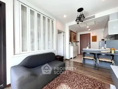 Modern living room with open kitchen and stylish decor