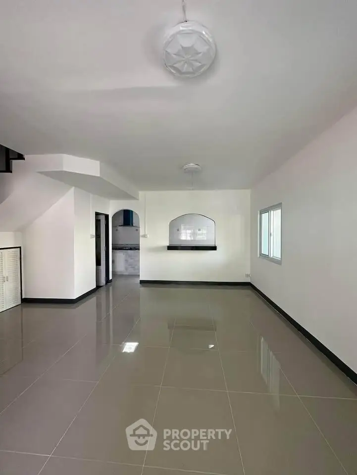 Spacious modern living room with sleek tile flooring and open layout