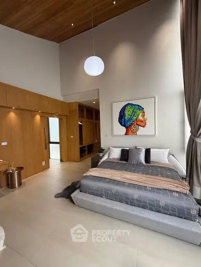 Luxurious modern bedroom with high ceilings and elegant decor