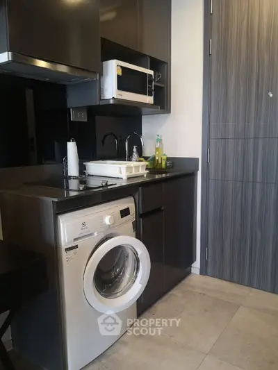 Modern kitchen with sleek cabinets and built-in appliances