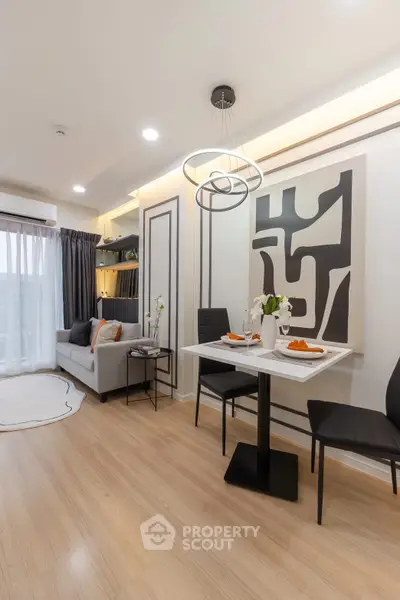 Modern living room with stylish decor and dining area in a cozy apartment