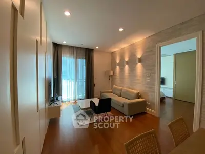 Modern living room with cozy seating and natural light