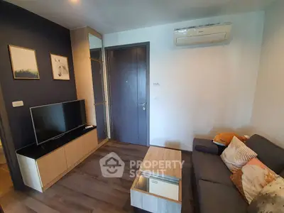 Modern living room with sleek furniture and air conditioning