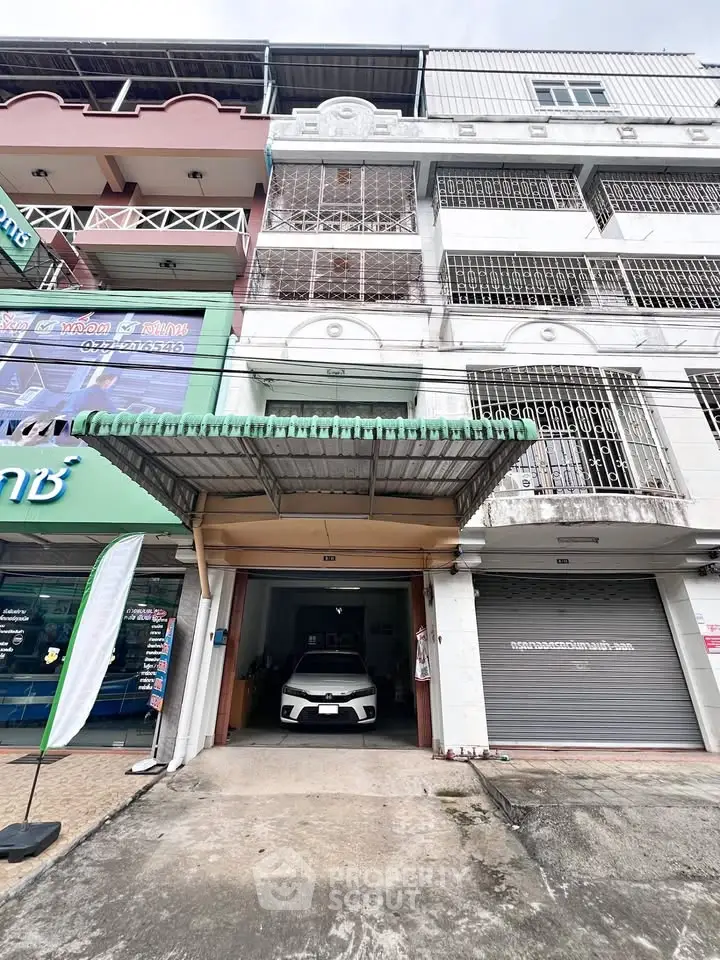 Commercial building with garage and parking space in urban area