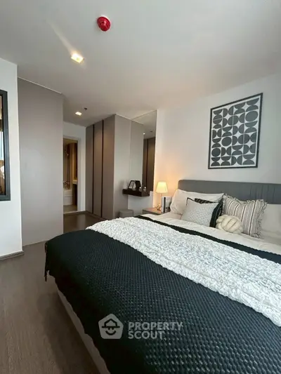 Modern bedroom with stylish decor and cozy ambiance