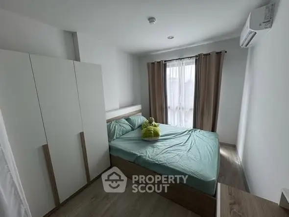 Cozy bedroom with modern furnishings and natural light