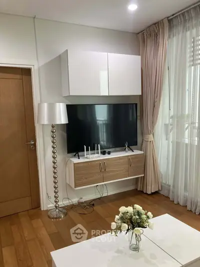 Modern living room with stylish TV setup and elegant decor