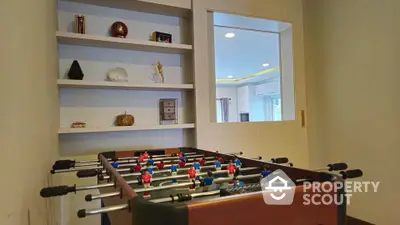 Stylish game room with foosball table and modern decor