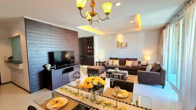 Luxurious living room with elegant decor, spacious seating, and natural light in modern apartment.