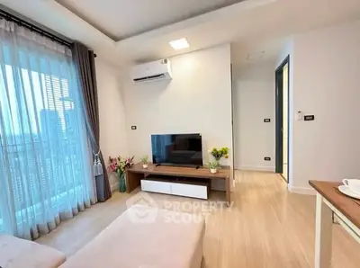 Modern living room with city view, stylish decor, and natural light