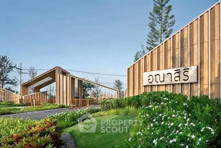 Modern architectural entrance with lush landscaping and wooden accents in a serene setting.