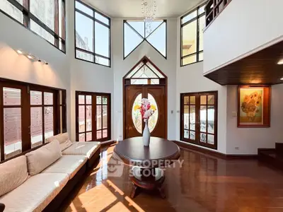 Stunning two-story living room with high ceilings and elegant decor