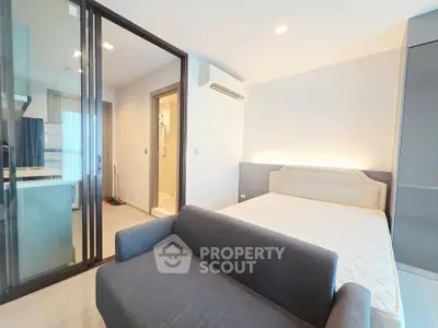 Modern studio apartment with open layout and sleek furnishings