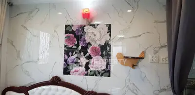 Elegant living room with floral wall art and stylish furniture