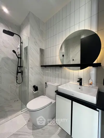 Modern bathroom with sleek fixtures and elegant marble tiles