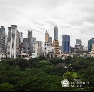 Stunning city skyline view with lush greenery, perfect for urban living enthusiasts.