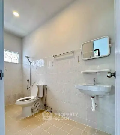 Spacious bathroom with modern fixtures and natural light